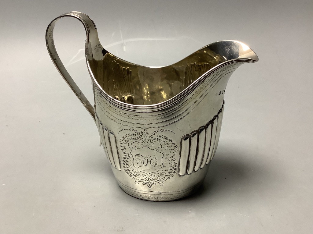 A George III part fluted silver oval cream jug, maker's mark rubbed, London, 1798, height 12.5cm, 4.5oz.